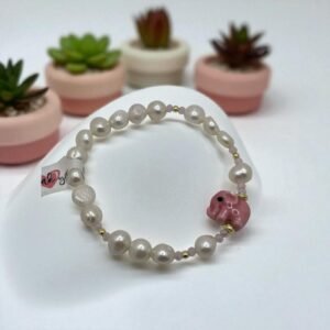 Pulsera Perla de rio con dije de elefante de cerámica