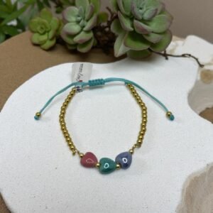 Pulsera cordón , hematitas y dijes de cerámica