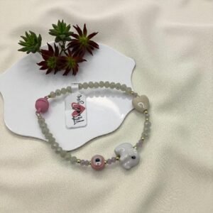 Pulsera cristales , dijes de cerámica y cierre con imán